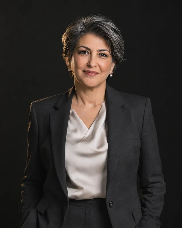 Chief executive of a multinational company in a charcoal suit